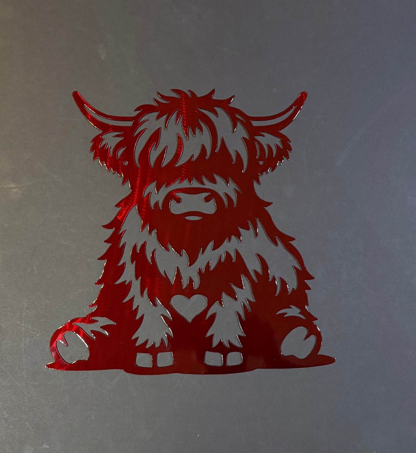Highland Cow Sitting with Heart